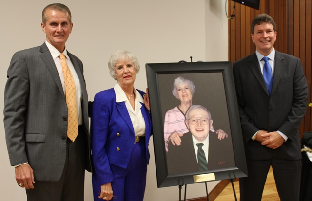 Judy Perry, at center, with Alc President Joe A. Stepp (left) and Executive Vice President Jim Stepp (right). The photo is of Mrs. Perry with her late husband, noted Paintsville, Ky. attorney, G. Chad Perry III.