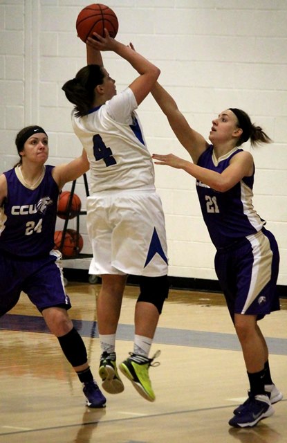 Senior Ariel Nickell rises for the jumper over CCU defenders.